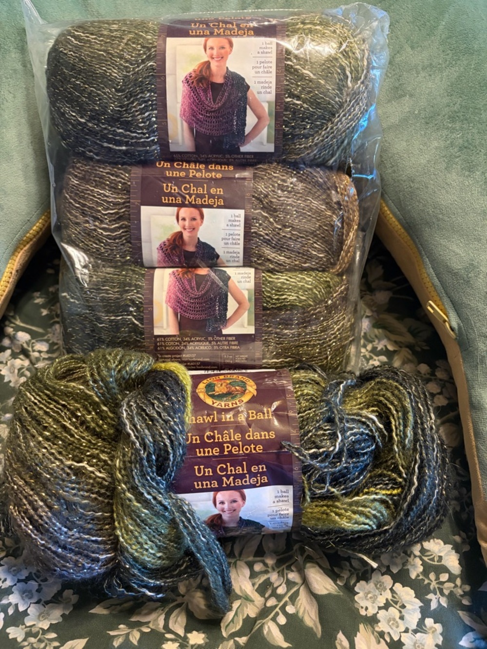 Lion Brand Shawl in a Ball 4 skeins Greens with gold thread woven through.